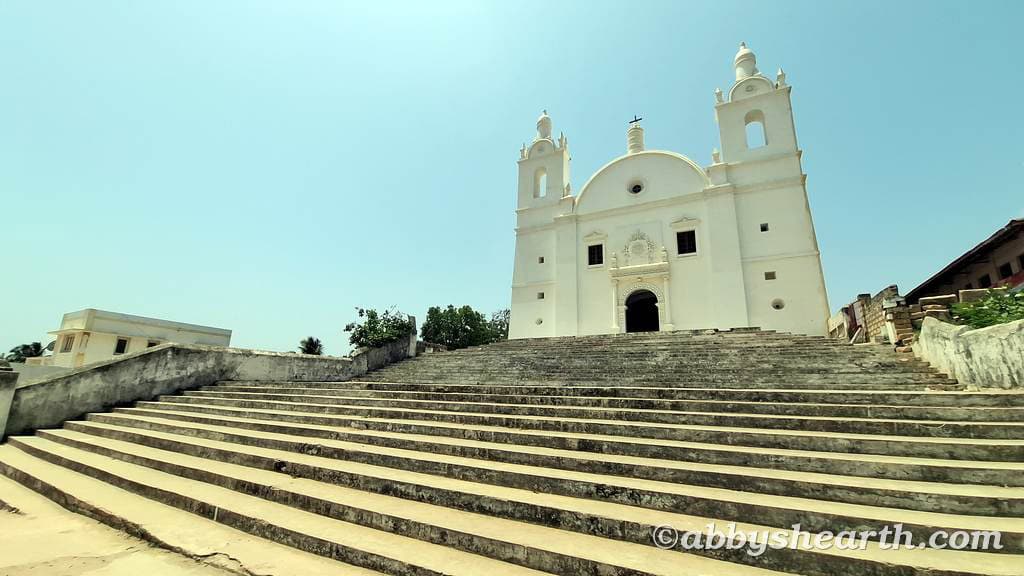 St Thomas Church in Diu with wide stone steps leading up to it.