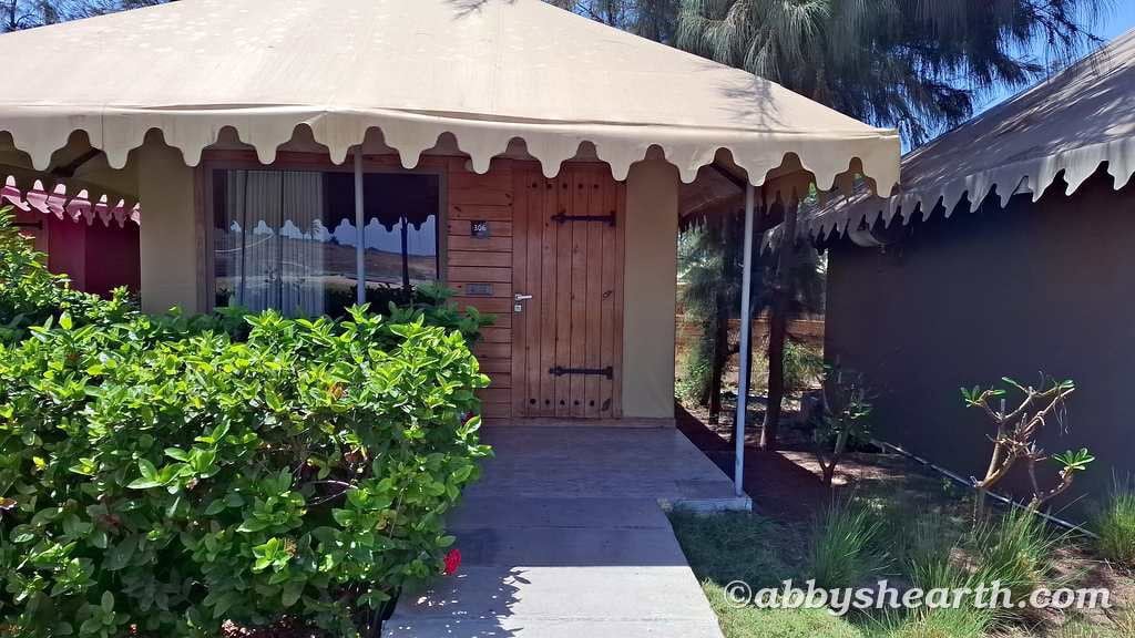 Cozy tented cottage surrounded by lush greenery in Diu.